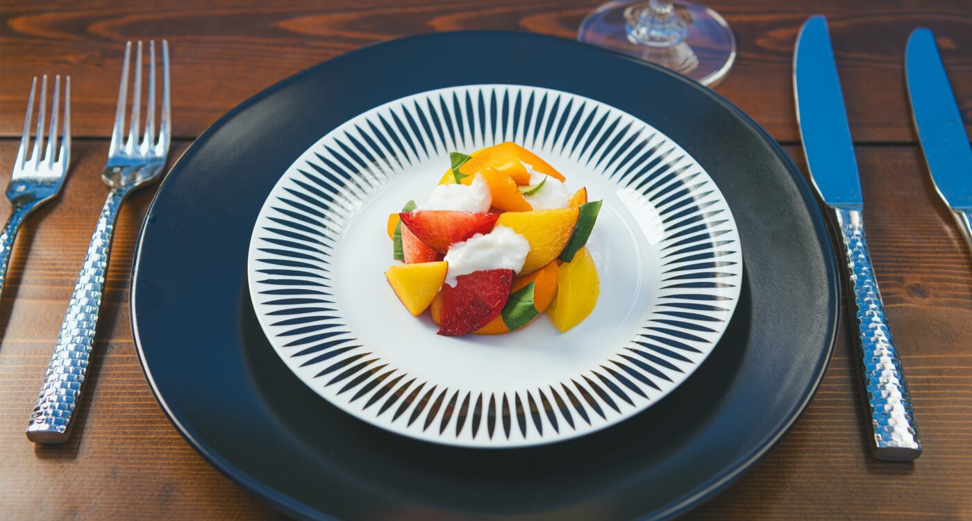 fresh fruit on a black and white plate