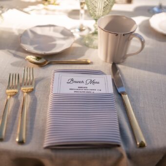 bunch menu in a stripped napkin on place setting