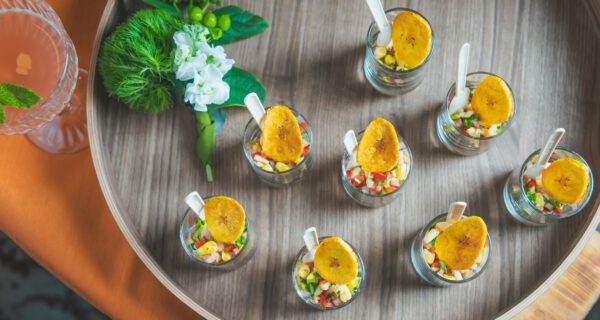 Ceviche cups on a round serving platter