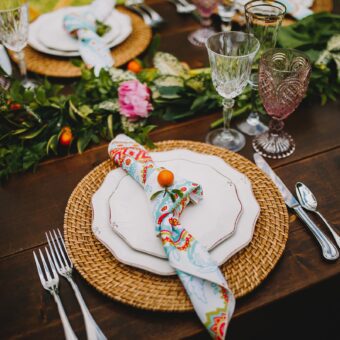 close up of garden table setting with a patterned napkin
