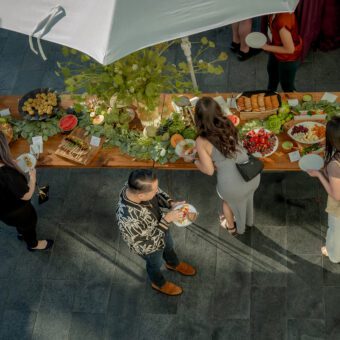 Overhead view of people enjoying grazing table