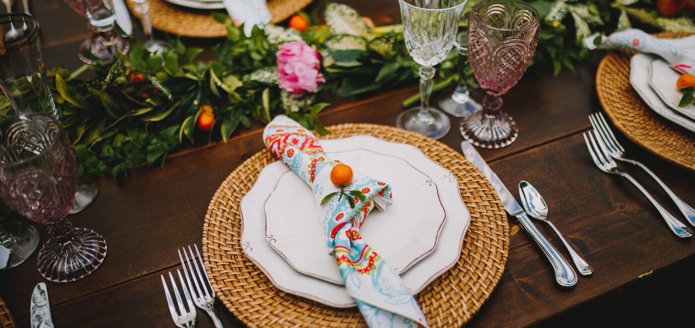 close up of garden table setting with a patterned napkin
