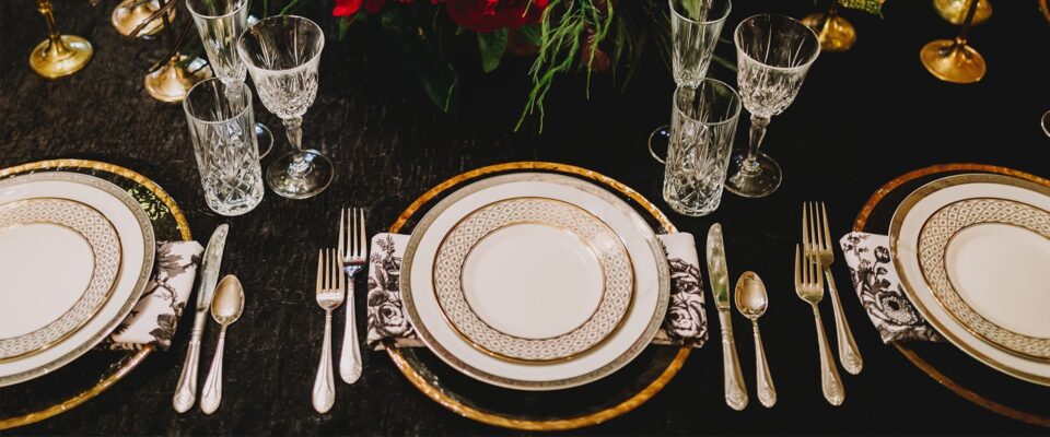 Table setting with white plates, napkins, and silverware
